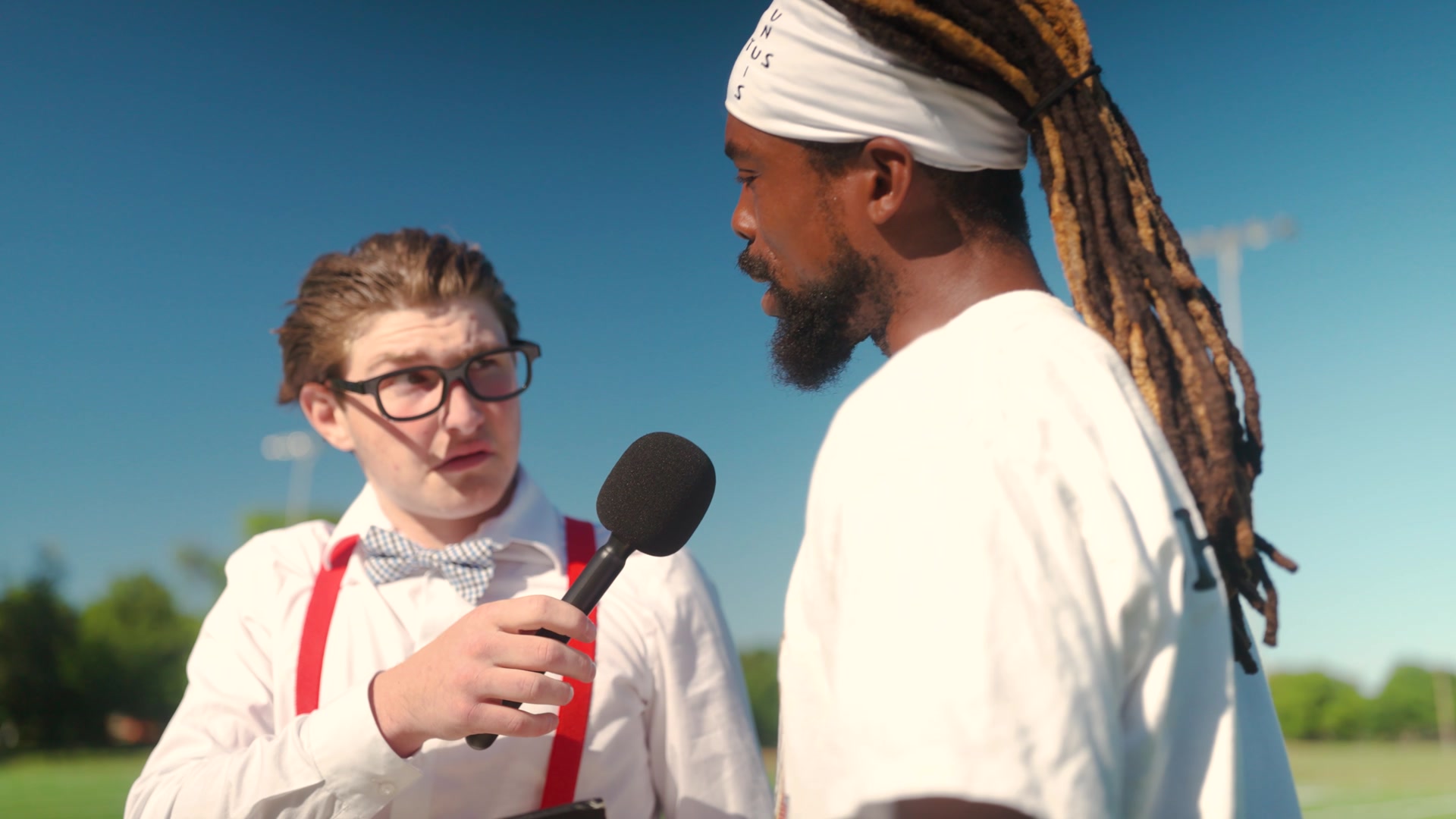 Interview scene with the coach and fictional sports reporter from the KEYngdom Athletics commercial